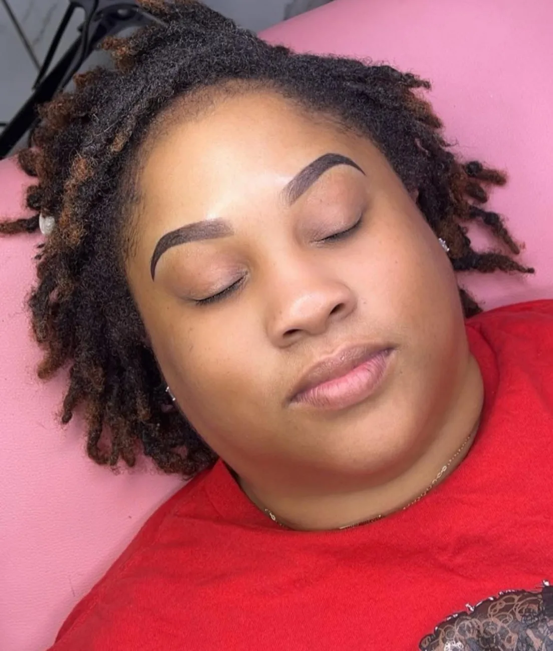 Same client after ombré powder brows — full, symmetrical shape with soft shading at the front.