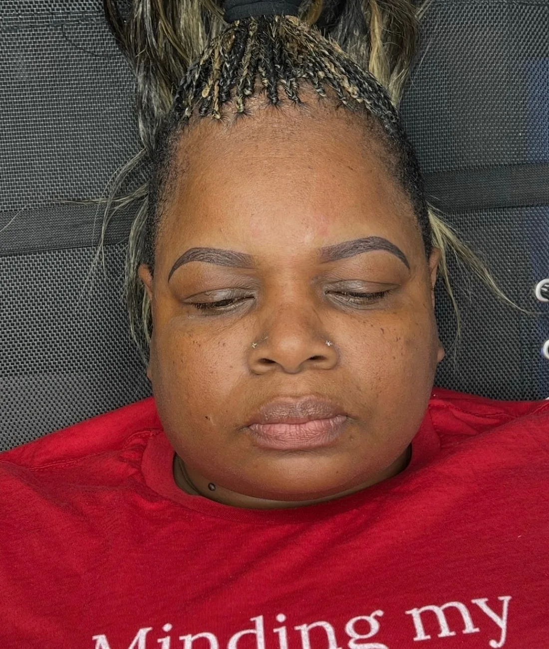 Same client after ombré powder brows — rich, even color and a defined tail.