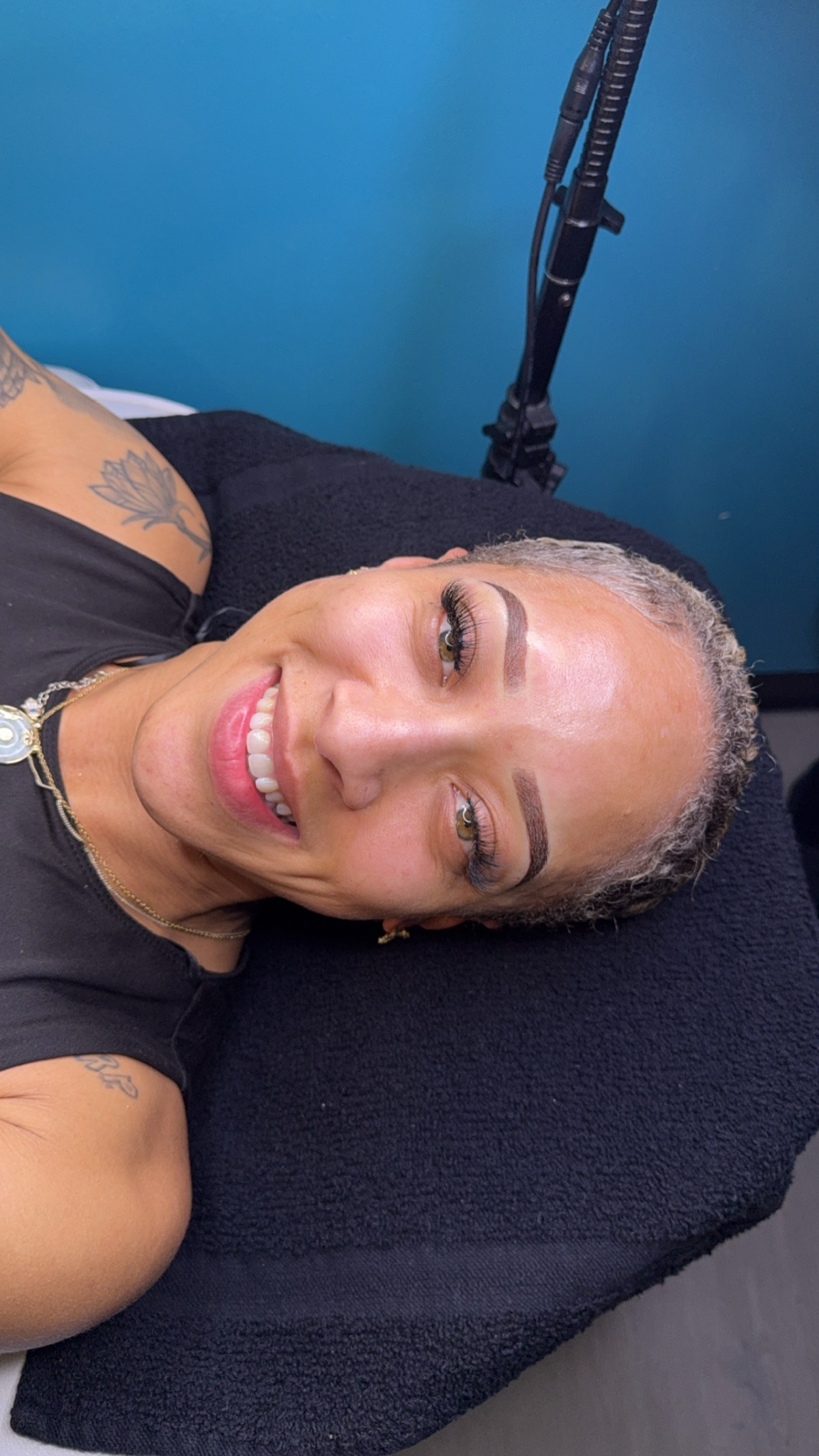 Client smiling with shaped ombre brows